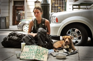 A homeless lady and her dog in New York City.